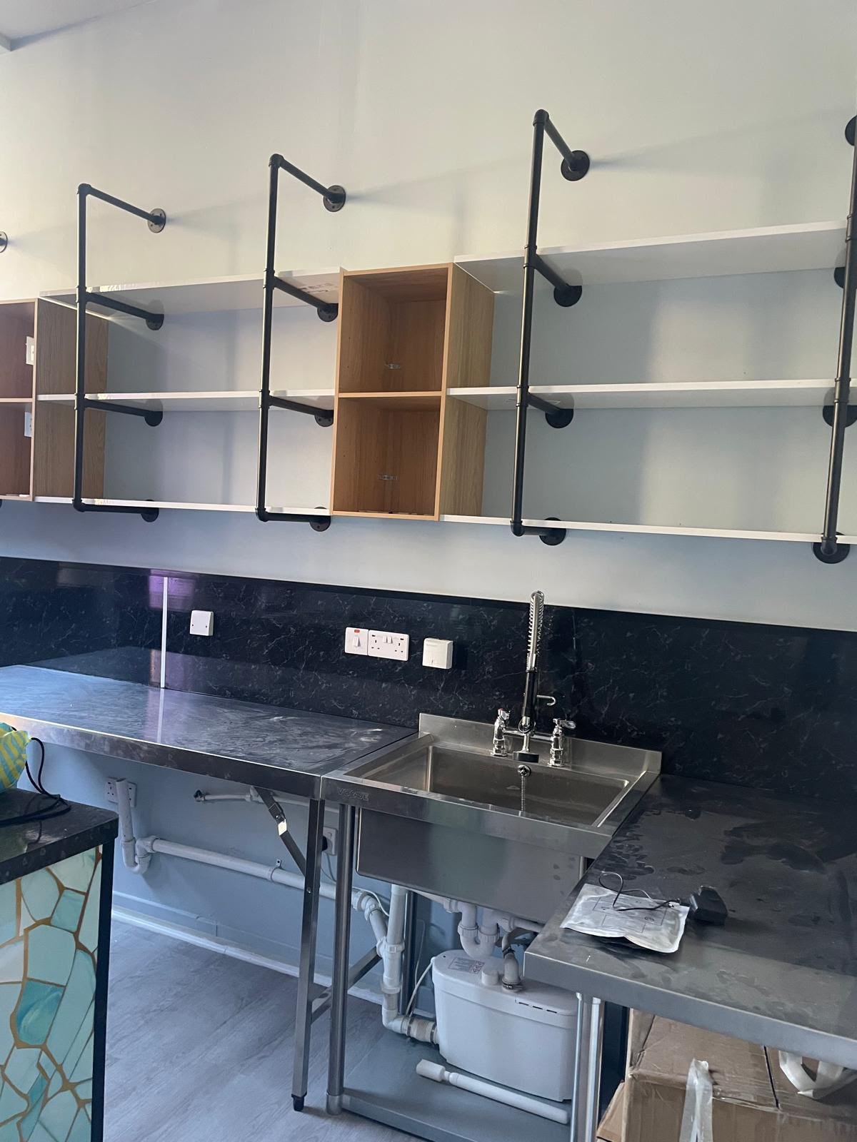 Commercial kitchen prep area with stainless steel counters