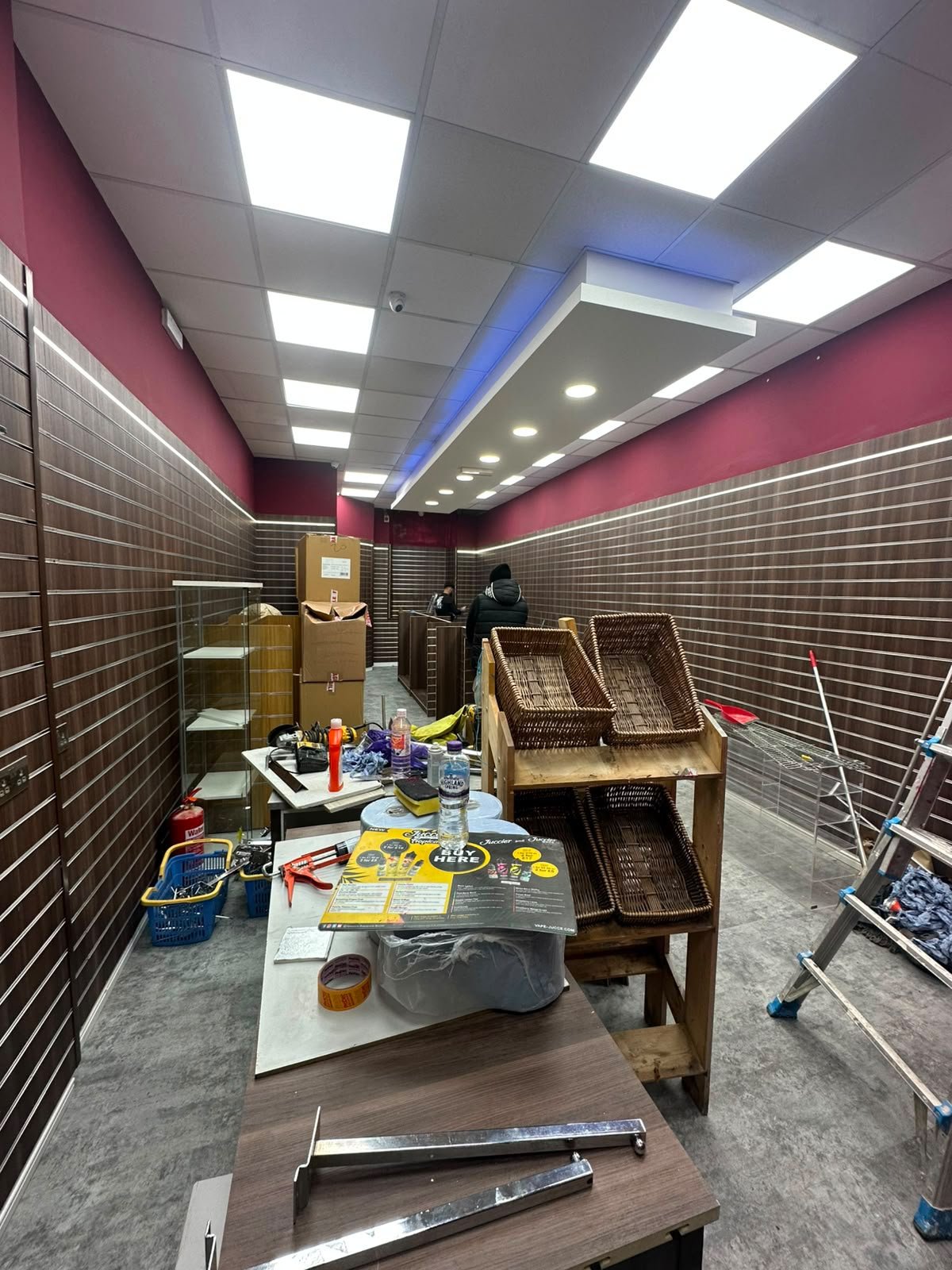 Convenience store fit-out with display shelving and baskets